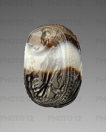 Engraved Scarab; Etruria; 400 - 380 B.C; Banded brown and white agate; 1.1 × 0.9 × 1.7 cm, 7,16 × 5,16 × 5,8 in