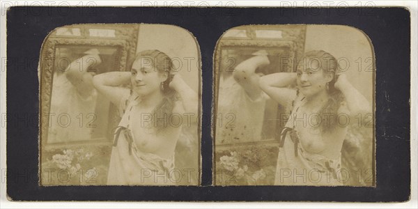 Woman before mirror with hands behind head, one breast exposed; French; 1855 - 1860; Hand-colored Albumen silver print
