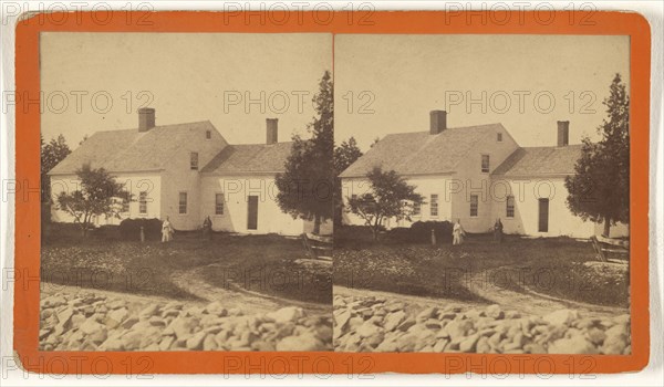 View of house with two women in the yard, white stone fence in foreground; about 1875; Albumen silver print