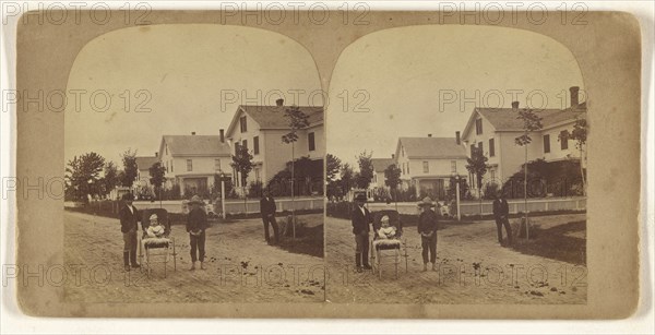 Children posed on street, baby girl in carriage; about 1865; Albumen silver print