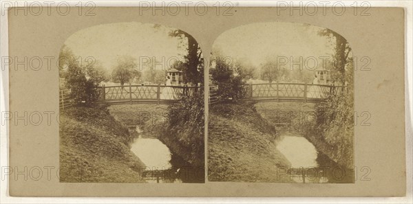 Woman crossing footbridge over stream; British; about 1860; Albumen silver print