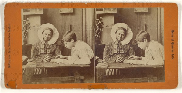 German woman and boy reading at table; German; about 1870; Albumen silver print