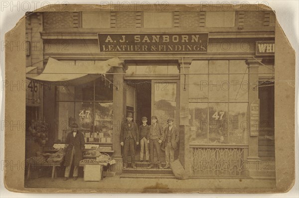 Five men posing in front of establishment of A.J. Sanborn, Leather & Findings; American; about 1875; Albumen silver print