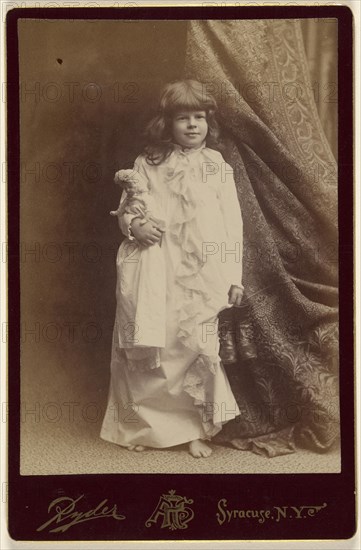 Ethel Butter in white dressing gown, holding pair of shoes and a doll, standing; Philip S. Ryder American, active 1870s - 1920s