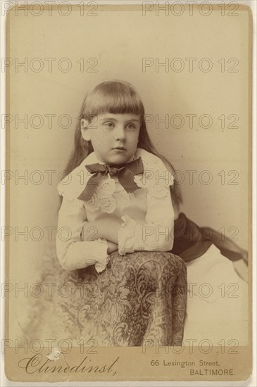 little girl posed against a chair back; Barnett M. Clinedinst, American, active 1870s - 1880s, about 1879; Albumen silver print