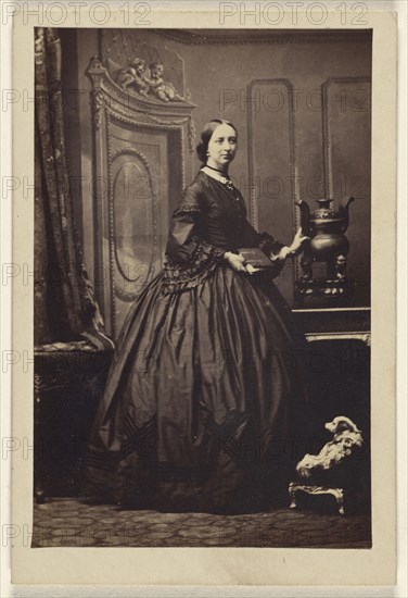 woman holding a book,standing; Camille Silvy, French, 1834 - 1910, 1862 - 1865; Albumen silver print