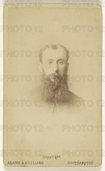 man with a long, square-cut beard, printed in vignette-style; Adams & Stilliard; May 1877; Albumen silver print