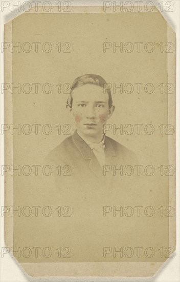 young man, printed in vignette-style; Isaac Rehn & Sons; 1865-1875; Hand-colored albumen silver print