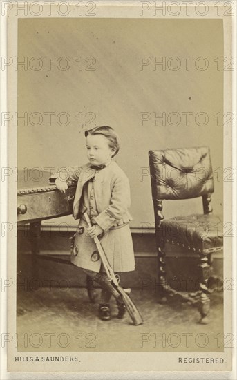 little boy standing, holding a toy rifle; Hills & Saunders, British, active about 1860 - 1920s, about 1865; Albumen silver