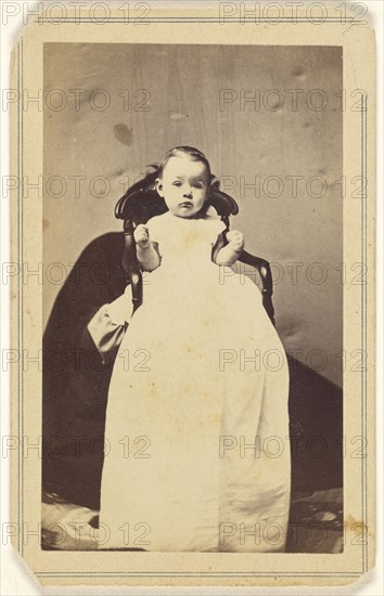 baby wearing a long dressing gown, with  figure behind holding up baby; J.H. Grotecloss, American, active New York, New York