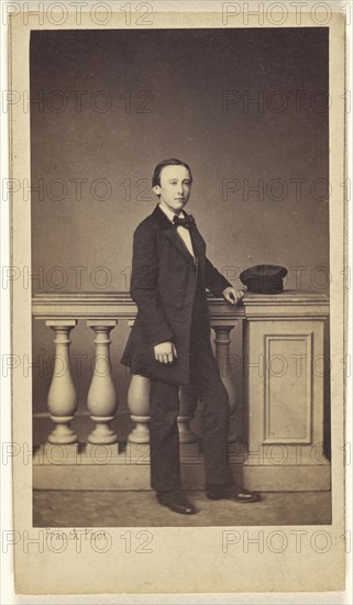 young man standing, his hat resting on a fake railing; Franck, François-Marie-Louis-Alexandre Gobinet de Villecholles, French