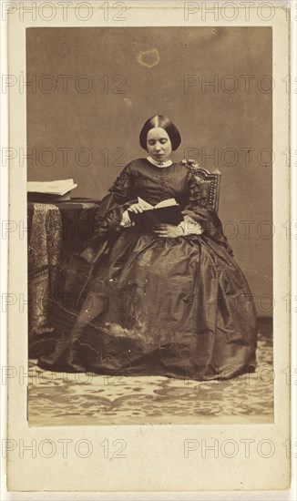 woman seated, reading a book; Disdéri & Cie; 1862 - 1865; Albumen silver print