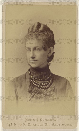 woman wearing a beaded and fringed necklace, printed in vignette-style; Kuhn & Cummins, American, about 1873 - 1881, 1870