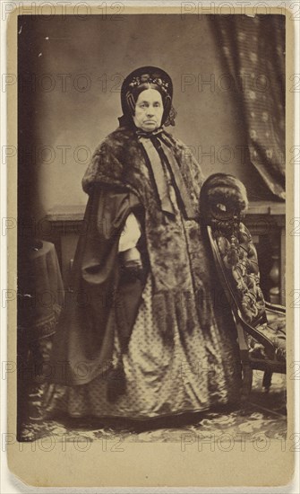 elderly woman wearing a fur coat and hat, standing; Partridge, American, active Bridgeport, Connecticut 1870s - 1890s, 1865