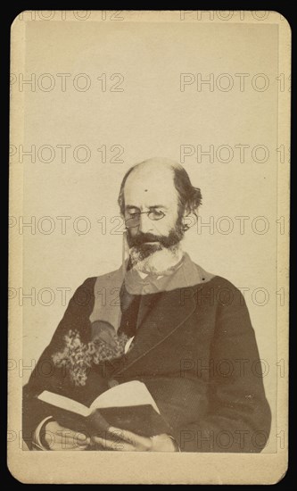 balding, bearded man reading while seated; William H. Mumler, American, 1832 - 1884, Boston, Massachusetts, United States; 1862