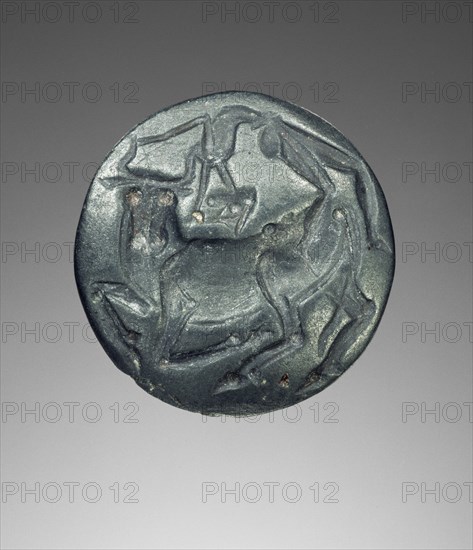 Lentoid engraved seal; Crete, Greece; 1450 - 1300 B.C; Blue-gray haematite; 7 × 1.9 cm, 2 3,4 × 3,4 in