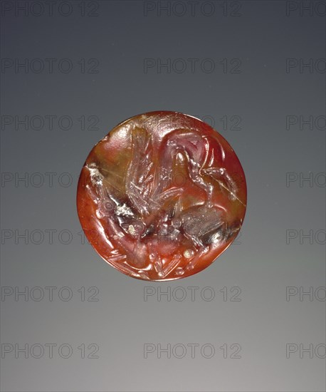 Lentoid engraved seal; Crete, Greece; about 1400 B.C. - 1300 B.C; Carnelian or jasper; 1.5 × 0.9 cm, 9,16 × 3,8 in