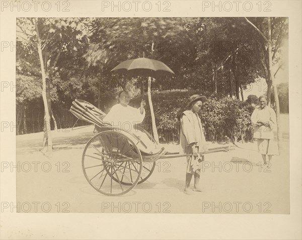 Rickshaw Driver and Passenger with Umbrella; Unknown maker; Peking, China; 1870 - 1890; Albumen silver print