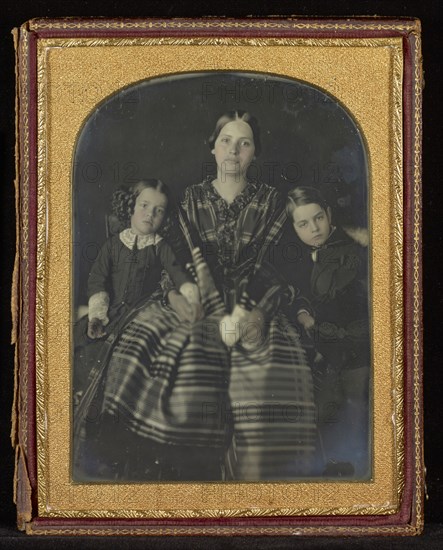 Portrait of a Seated Woman with a Young Girl and Boy on Either Side; Mexico; about 1850s; Hand-colored Daguerreotype