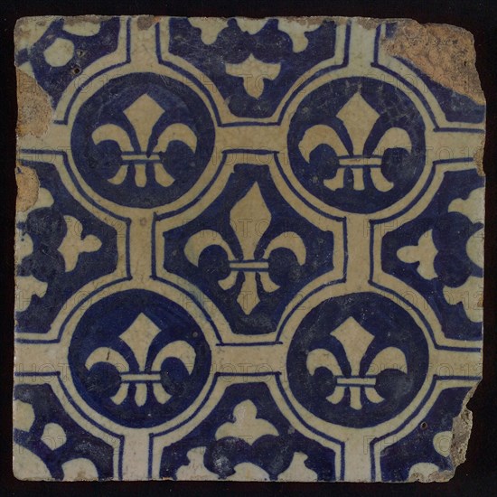 Two-tone tile, blue on white background, four circles with white French lily around central ornament with lily, wall tile