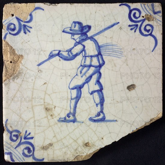 Figure tile, blue with farmer with stick and forest straw, corner motif oxen head, wall tile tile sculpture ceramic earthenware