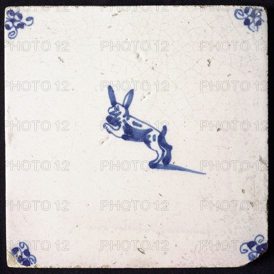 Animal tile, leaping hare to the left, in blue on white, corner motif spider, wall tile tile sculpture ceramic earthenware glaze