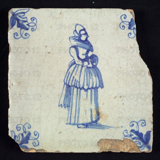 Figure tile, blue with standing lady with millstone collar and included overcoat, corner motif, vane leaf, wall tile
