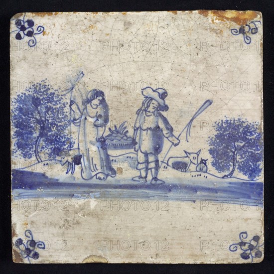 Figure tile, blue with amorous shepherd scene with shepherd and shepherdess, standing, shy position, corner motif spider, wall