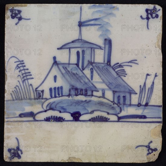Scene tile, blue with landscape with houses and (church?) Tower, in the background sailing ships, corner design spider, wall