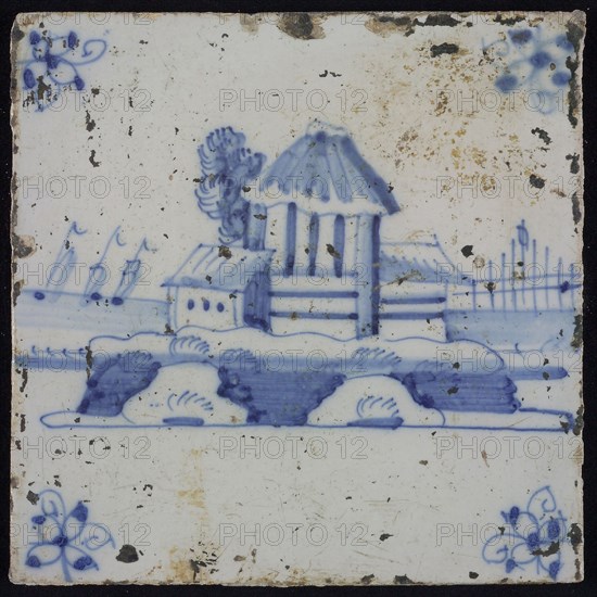 Scene tile, blue with landscape with high building, corner motif spider, wall tile tile sculpture ceramic earthenware glaze