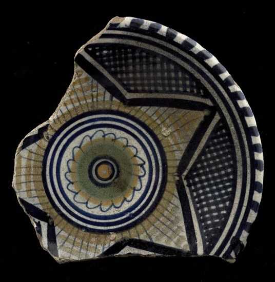 Fragment of the majolica dish, polychrome, in the middle rosette, outside of that star motif, plate crockery holder soil find