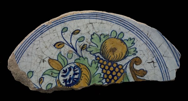 Fragments of majolica dish, polychrome, fruit bowl on one foot, plate dish crockery holder soil find ceramic earthenware glaze