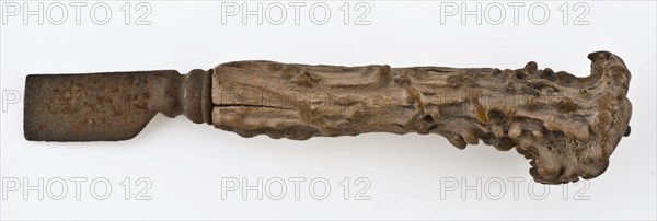 Knife with iron blade and legs raises with capriciously carved decoration, knife cutlery soil find iron bone metal, archeology