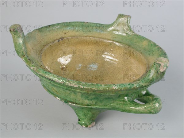 Earthenware stain or test, with stem and ear, green and yellow glazed ...