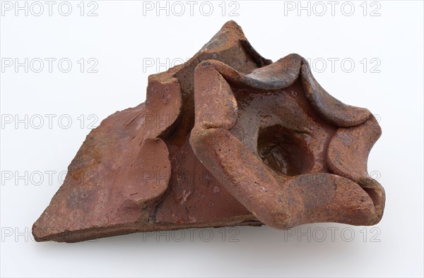 Fragment of earthenware fire dome with molded rosette, glazed, firecock fragment earth discovery ceramic earthenware glaze lead