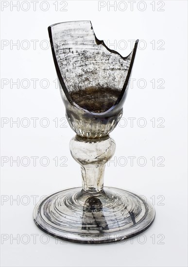 Fragment of the foot, trunk and part of the calyx goblet, drinking glass drinking utensils tableware holder soil find glass, cm