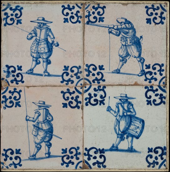 Tile field, four tiles, figure decor, blue on white, all soldiers, one with drum, corner design voluut, tiled field wall tile