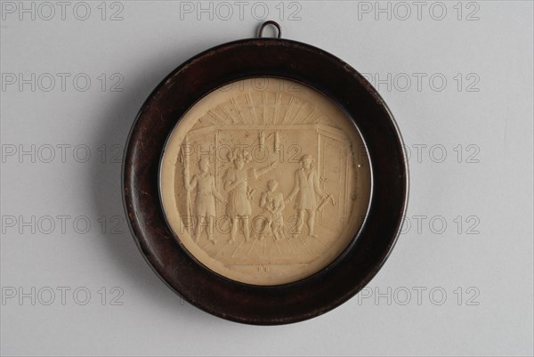 Small circular relief plaque in wooden frame, with historical representation of four people and child in room, plaque embossed