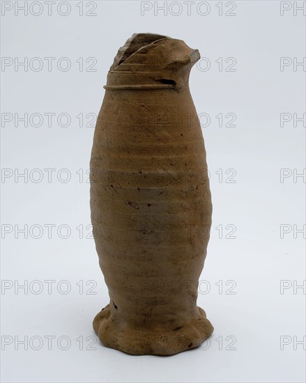 Stoneware jug placed on squeeze foot, Jug or jacobakan, Jug or jacobakan jug crockery holder soil find ceramic stoneware, hand