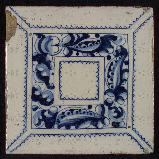 Tile, blue draft on white ground, central decor with square frame in which foglie ornament, zigzag lines, wall tile