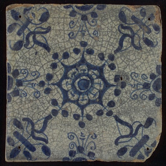 Tile, blue on white, central flower within star shape, three-spot around, half rosette, corner pattern lily, wall tile