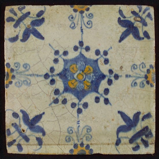 Tile, blue pull and orange on white, central flower within star shape, three-piece around, half rosette, corner pattern lily