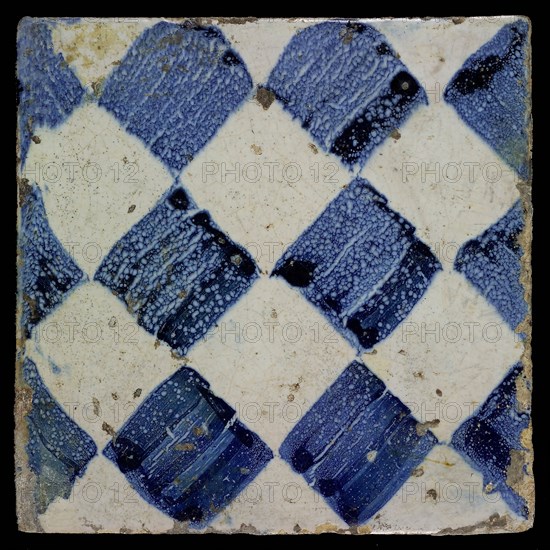 Ornament tile, blue on white, with dark blue irregularly sponged diamond pattern as checkerplate, small windows, floor tile