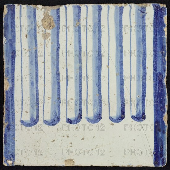 Tile of chimney pilaster, blue on white, part of column with cannelure, chimney pilaster tile pilaster footage fragment ceramic