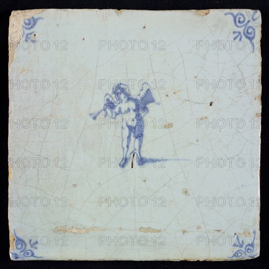 Light blue tile with blue putto with wind instrument; corner pattern ox head, wall tile tile sculpture ceramic earthenware glaze