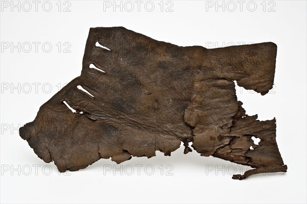Fragment of low leather shoe, consisting of heel, side with lacing holes, shoe footwear clothing soil finding leather, Rotterdam