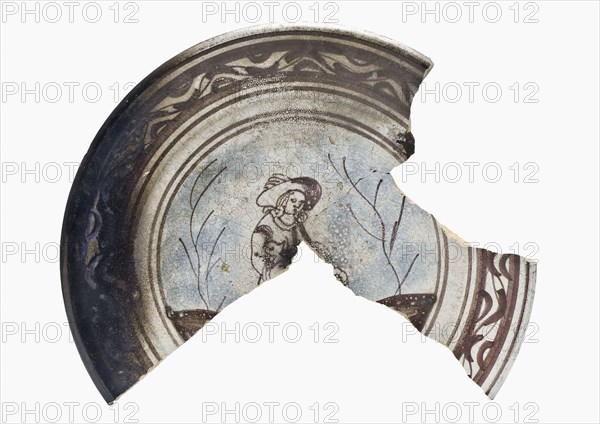 Fragment majolica dish decorated in purple and blue on white background, depicting male, dish crockery holder soil find ceramic