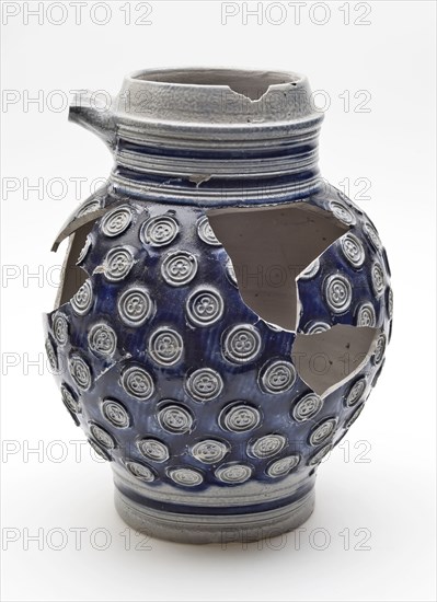 Stoneware jug decorated with small rosettes on blue background, jug crockery holder soil find ceramic stoneware glaze salt glaze