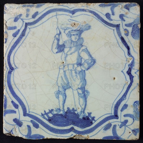 White tile with blue warrior in accolade-shaped frame; corner motif wing leaf, wall tile tile sculpture ceramic earthenware