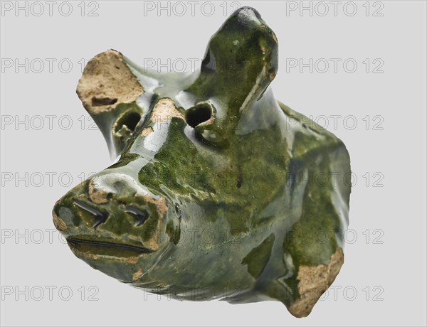 Fragments of pottery piggy banks, two muzzle fragments and one leg, green glazed, piggy bank piggy bank holder fragment